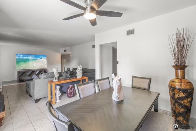 dining area featuring ceiling fan and light tile patterned floors