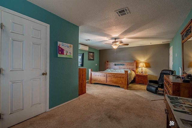 carpeted bedroom featuring a wall mounted AC, ceiling fan, and a textured ceiling