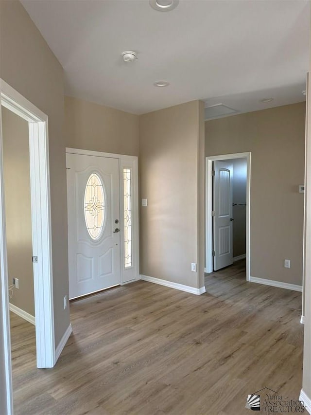 entryway with light hardwood / wood-style floors