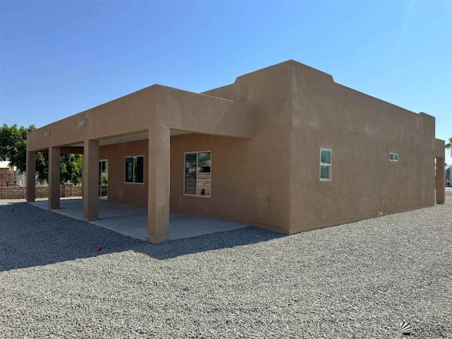 back of house featuring a patio