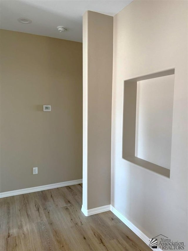 empty room with light wood-type flooring