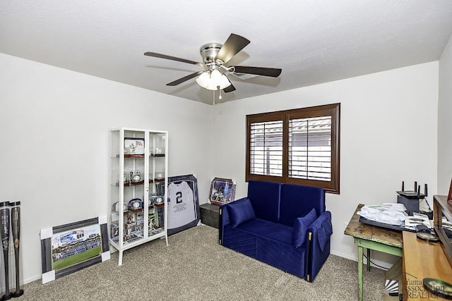 interior space featuring carpet and ceiling fan