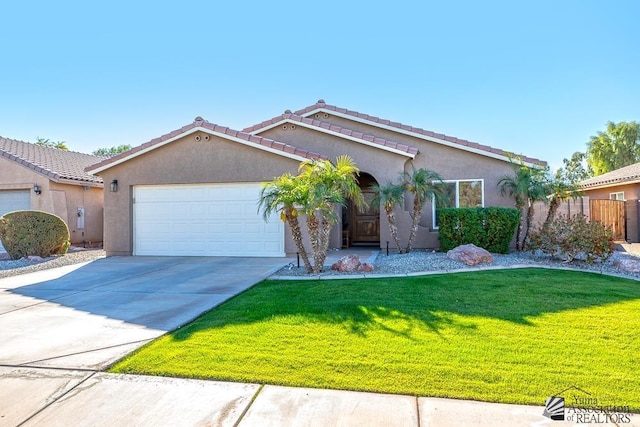 view of front facade featuring a garage and a front lawn