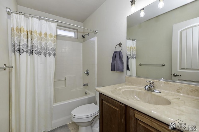 full bathroom with tile patterned floors, shower / bathtub combination with curtain, vanity, and toilet