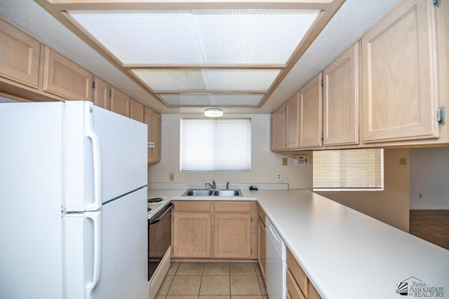 kitchen featuring light tile patterned flooring, sink, light brown cabinets, and white appliances