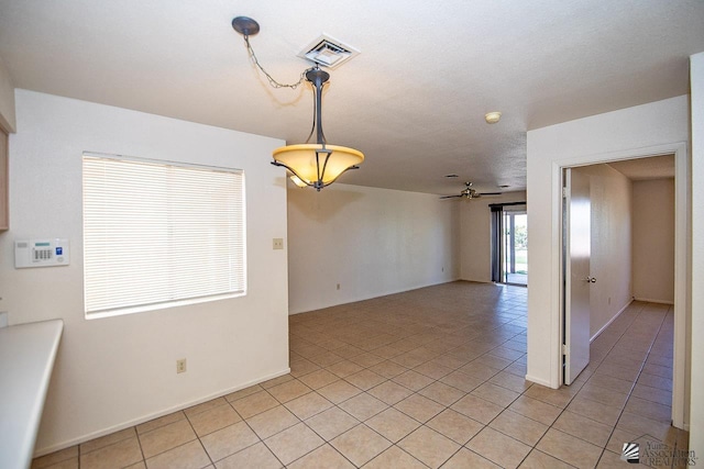 interior space featuring ceiling fan and light tile patterned flooring