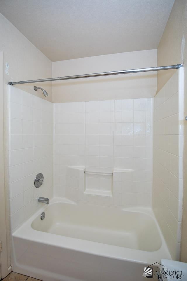 bathroom featuring shower / tub combination and tile patterned floors