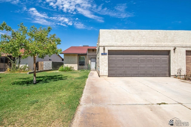 view of front of home with a garage and a front yard