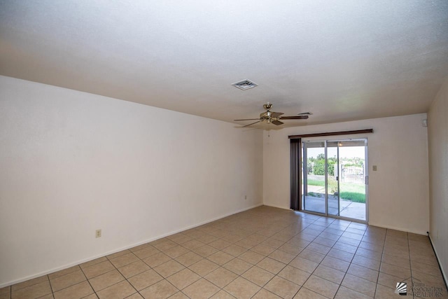 unfurnished room with light tile patterned flooring and ceiling fan