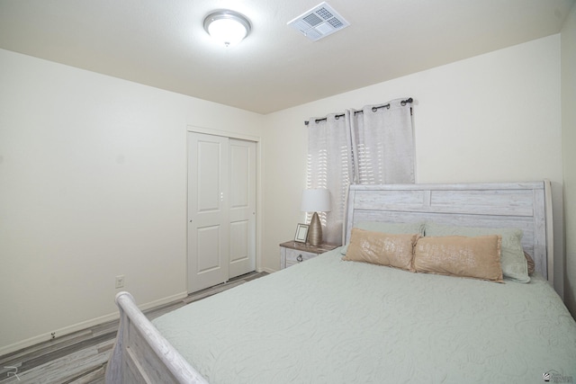 bedroom featuring a closet and hardwood / wood-style floors