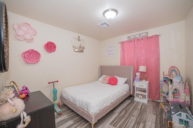 bedroom featuring wood-type flooring