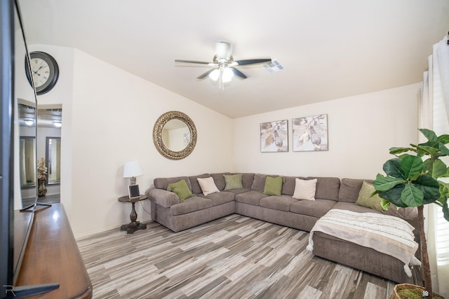 living room featuring light wood-type flooring and ceiling fan