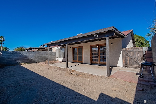 rear view of property featuring a patio area