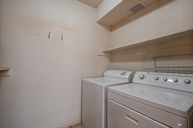 laundry room featuring washing machine and clothes dryer