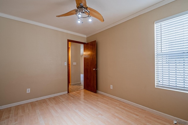 unfurnished room with ceiling fan, ornamental molding, and light wood-type flooring