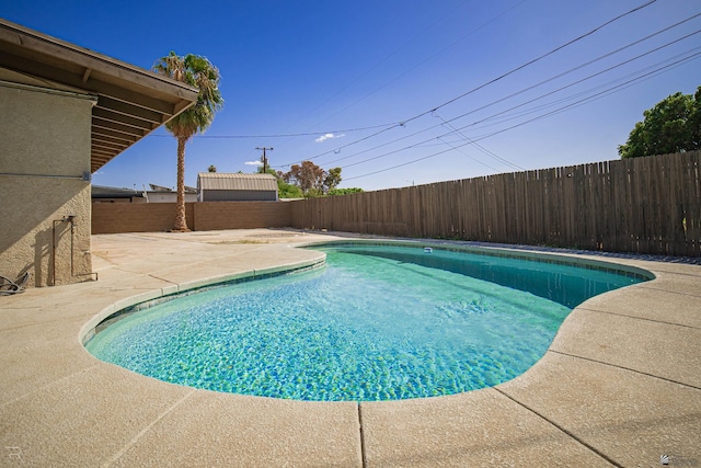 view of swimming pool featuring a patio area