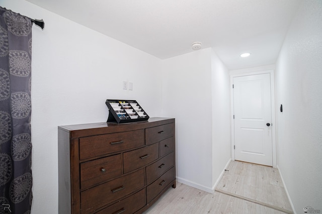 hall with light hardwood / wood-style flooring