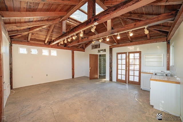 interior space featuring french doors, sink, beamed ceiling, track lighting, and wood ceiling