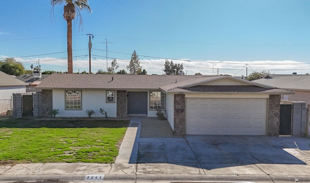 single story home featuring a front yard and a garage