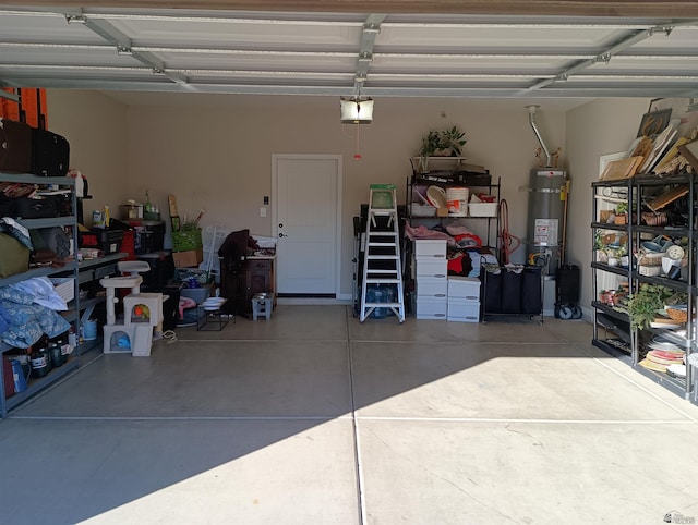 garage with secured water heater and a garage door opener