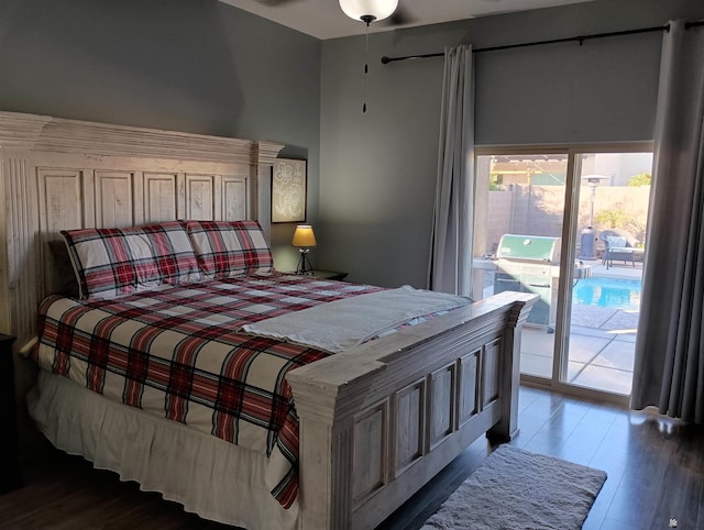 bedroom featuring hardwood / wood-style floors and access to outside