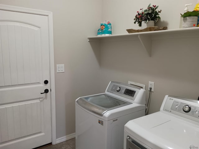 clothes washing area featuring separate washer and dryer