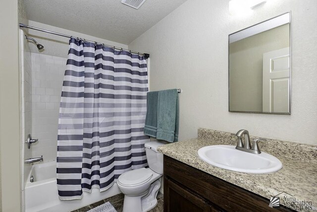 full bath featuring vanity, visible vents, a textured ceiling, toilet, and shower / tub combo with curtain