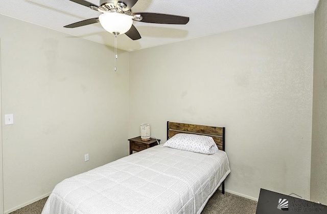 bedroom featuring baseboards, a ceiling fan, and carpet floors