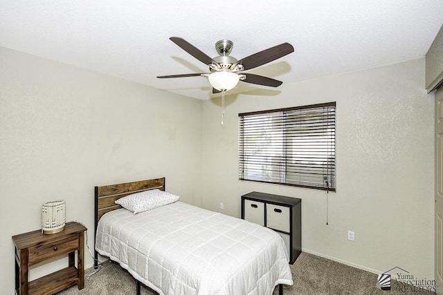 carpeted bedroom with baseboards and ceiling fan