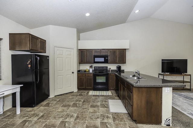 kitchen with black appliances, a sink, dark countertops, lofted ceiling, and dark brown cabinets