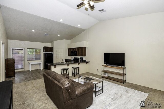 carpeted living room featuring visible vents, a sink, recessed lighting, lofted ceiling, and ceiling fan