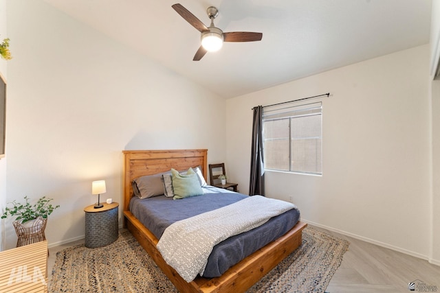 bedroom with lofted ceiling and ceiling fan