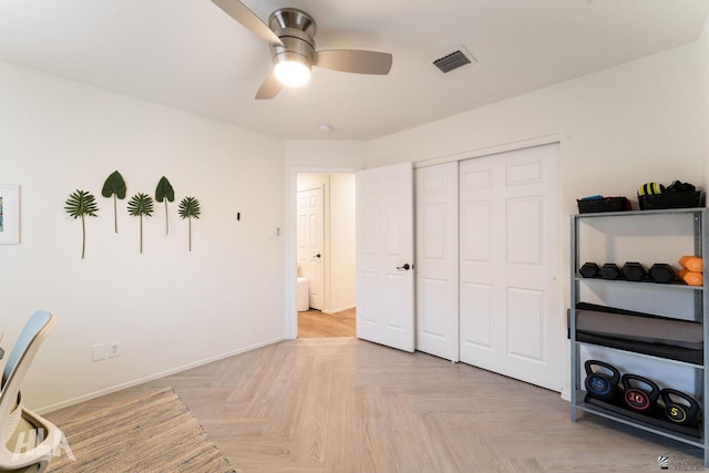 office area featuring light parquet floors and ceiling fan