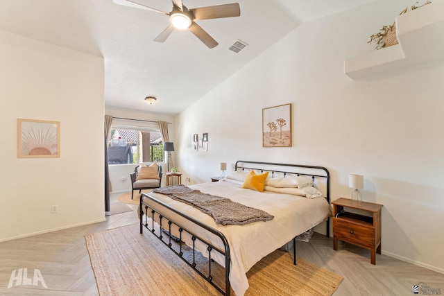 bedroom featuring lofted ceiling, ceiling fan, and light parquet floors