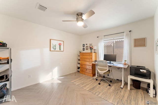 office featuring ceiling fan and light parquet floors