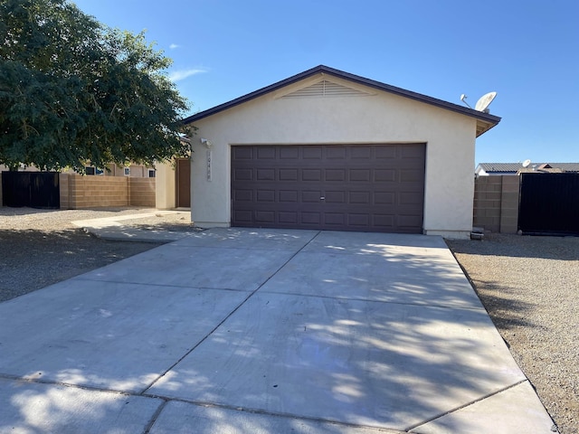 exterior space featuring a garage and an outdoor structure