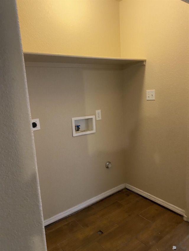 washroom with hookup for an electric dryer, washer hookup, and dark hardwood / wood-style floors