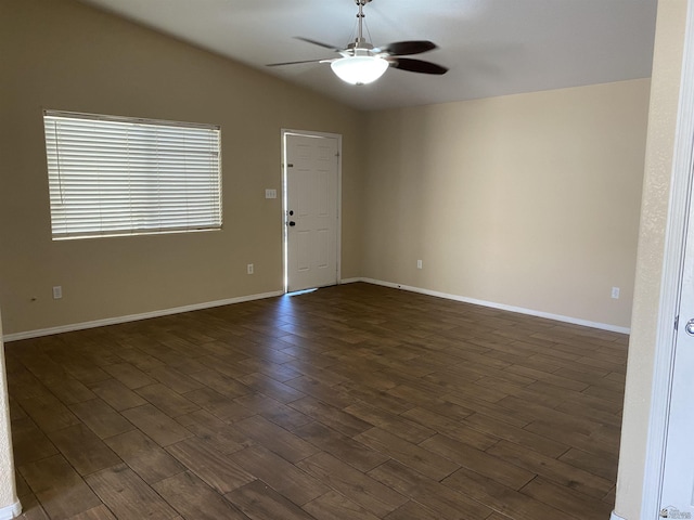 unfurnished room with dark hardwood / wood-style floors, ceiling fan, and vaulted ceiling