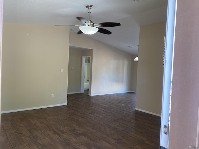 unfurnished room featuring ceiling fan, dark hardwood / wood-style flooring, and lofted ceiling