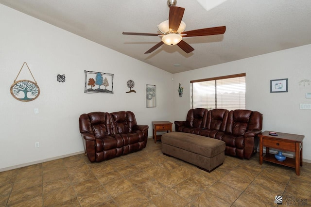 living room with ceiling fan and vaulted ceiling