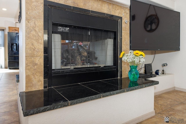 details featuring black refrigerator with ice dispenser