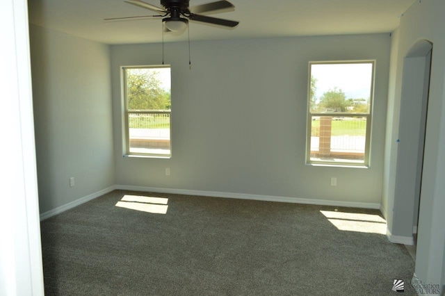 carpeted empty room with ceiling fan