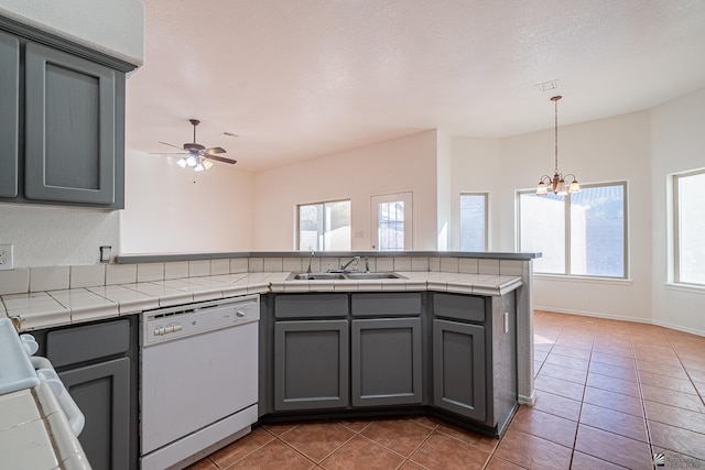 kitchen with gray cabinets, sink, white dishwasher, and ceiling fan with notable chandelier