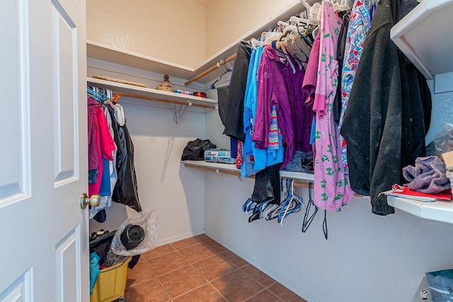 spacious closet featuring tile patterned flooring