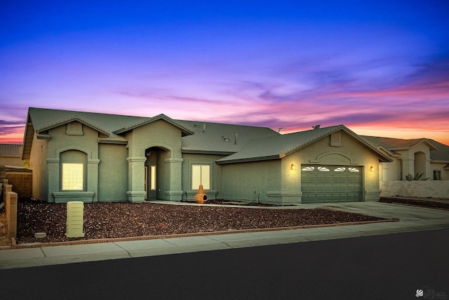 view of front of property with a garage