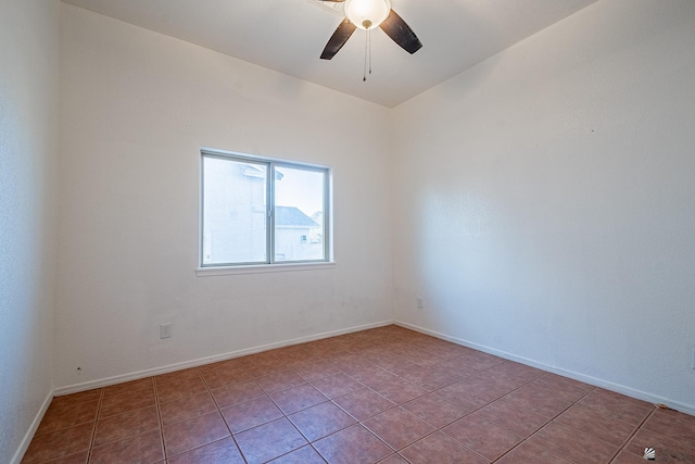 unfurnished room with ceiling fan and light tile patterned floors