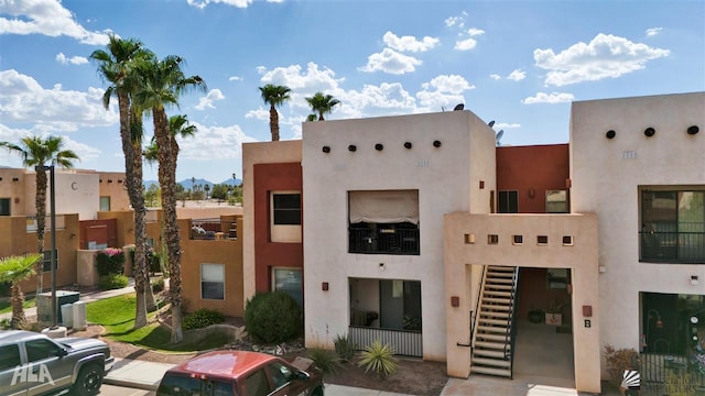 view of property featuring stairway