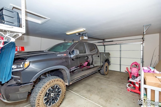 garage featuring a garage door opener