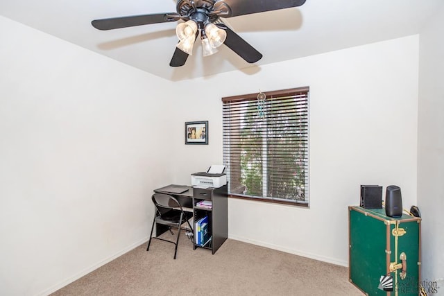 office with a ceiling fan, carpet flooring, and baseboards