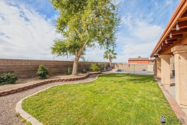 view of yard with a fenced backyard and a fenced in pool